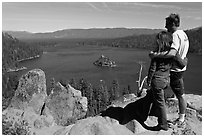 Couple standing above Emerald Bay, Lake Tahoe, California. USA (black and white)