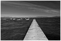 Dock, small boats, and blue waters and mountains, Lake Tahoe, California. USA (black and white)