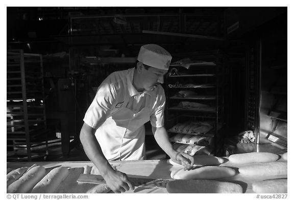 Baker preparing San Francisco sourdough bread. San Francisco, California, USA (black and white)