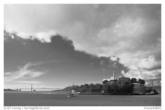 Golden Gate Bridge and Alcatraz under large cloud. San Francisco, California, USA (black and white)