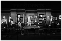 Wax figures of presidents with one outlier, Madame Tussauds. San Francisco, California, USA (black and white)