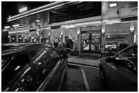 Cars and neon light of dinner at night. San Francisco, California, USA (black and white)