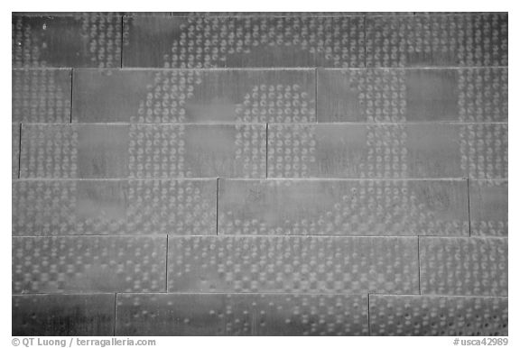 Copper wall detail with first 3 letters, De Young museum. San Francisco, California, USA (black and white)