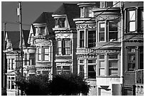 Row of brightly painted Victorian houses, Haight-Ashbury District. San Francisco, California, USA (black and white)