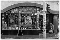 Rainny sidewalk and store with psychadelic colors. San Francisco, California, USA (black and white)