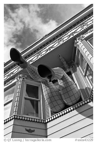 Giant legs with stockings hanging from a second floor, Haight-Ashbury District. San Francisco, California, USA