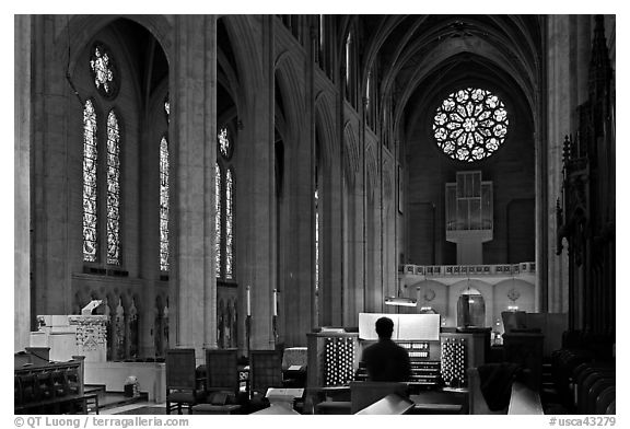 Church organist playing inside Grace Cathedral. San Francisco, California, USA