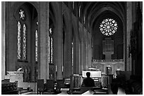 Church organist playing inside Grace Cathedral. San Francisco, California, USA ( black and white)
