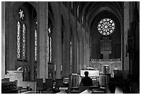 Church organist playing inside Grace Cathedral. San Francisco, California, USA (black and white)