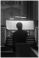 Musician playing organ, Grace Cathedral. San Francisco, California, USA (black and white)