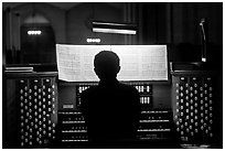 Organist and musical score, Grace Cathedral. San Francisco, California, USA (black and white)