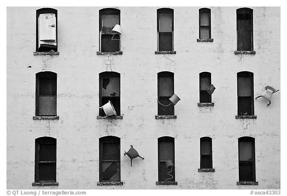 Facade with chairs installed as art. San Francisco, California, USA (black and white)