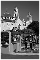 School fair booth, children, and Mission Dolores in the background. San Francisco, California, USA (black and white)