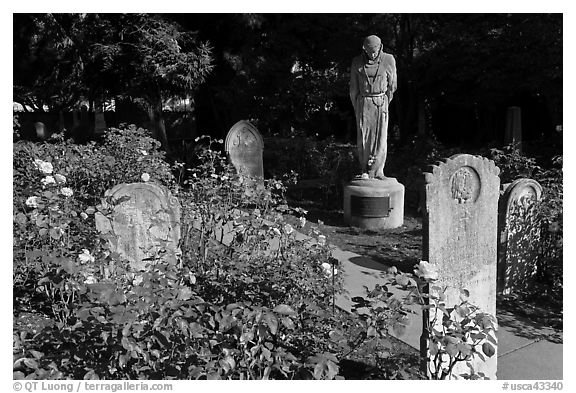 Gravestones and statue, Mission Dolores. San Francisco, California, USA