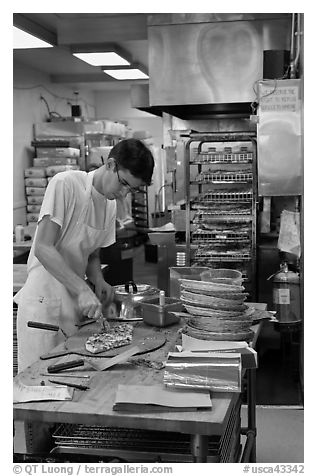 Man preparing pizza, Haight-Ashbury district. San Francisco, California, USA (black and white)