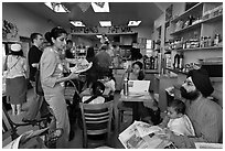 Inside pizzaria with Make love not war inscription, Haight-Ashbury district. San Francisco, California, USA (black and white)