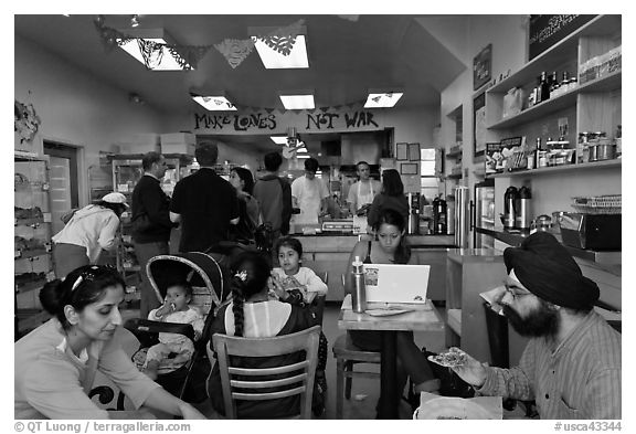 Indian family inside popular pizza restaurant, Haight-Ashbury district. San Francisco, California, USA