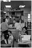 Tables and counter inside pizza restaurant, Haight-Ashbury district. San Francisco, California, USA (black and white)