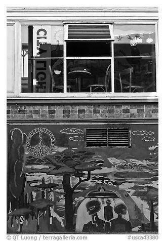 Decor from beatnik period and window reflecting city light sign, North Beach. San Francisco, California, USA