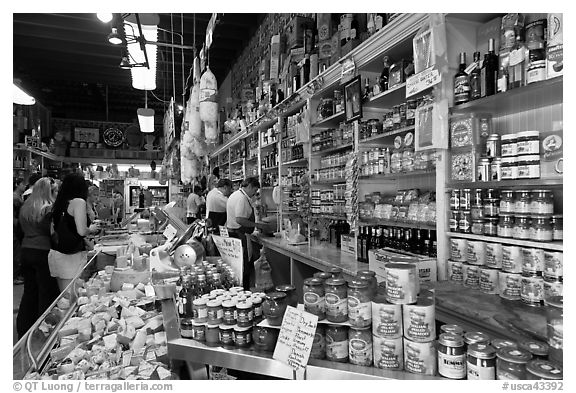 Italian grocery store interior with customers, Little Italy, North Beach. San Francisco, California, USA (black and white)