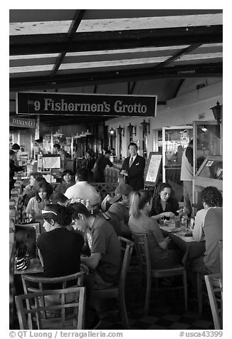 Outdoor terrace of seafood restaurant, Fishermans wharf. San Francisco, California, USA (black and white)