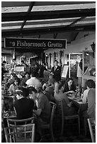 Outdoor terrace of seafood restaurant, Fishermans wharf. San Francisco, California, USA ( black and white)