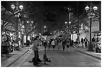 Musician and Third Street Promenade. Santa Monica, Los Angeles, California, USA (black and white)