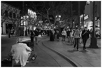 People walking past mime on Third Street Promenade. Santa Monica, Los Angeles, California, USA ( black and white)