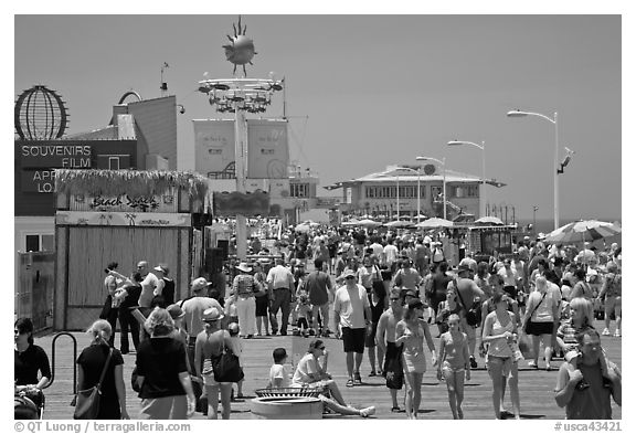 Summer crowds on Santa Monica Pier. Santa Monica, Los Angeles, California, USA (black and white)