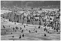 Throng of beachgoers, Santa Monica Beach. Santa Monica, Los Angeles, California, USA ( black and white)