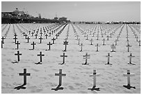 Memorial to fallen soldiers and Santa Monica Pier. Santa Monica, Los Angeles, California, USA (black and white)