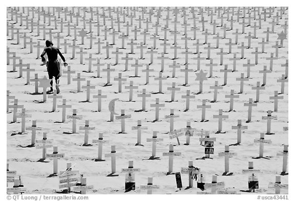 Boy in beachwear walking amongst crosses. Santa Monica, Los Angeles, California, USA