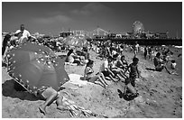 Beach unbrellas and Santa Monica Pier. Santa Monica, Los Angeles, California, USA (black and white)