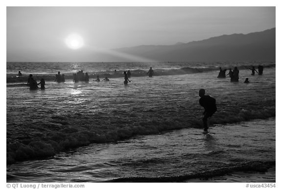 Sunset on beach shore, Santa Monica Beach. Santa Monica, Los Angeles, California, USA (black and white)