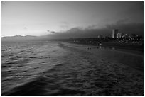 Ocean and beachfront at sunset. Santa Monica, Los Angeles, California, USA ( black and white)