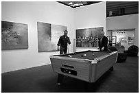 Playing pool inside a contemporary art gallery, Bergamot Station. Santa Monica, Los Angeles, California, USA ( black and white)