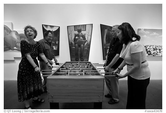 Playing soccer table game in art gallery, Bergamot Station. Santa Monica, Los Angeles, California, USA