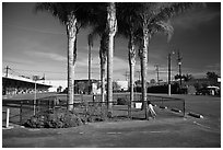 Girl and people park, Bergamot Station arts center. Santa Monica, Los Angeles, California, USA (black and white)