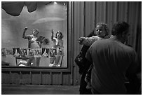 Toddler echoing performance artists, Bergamot Station. Santa Monica, Los Angeles, California, USA (black and white)