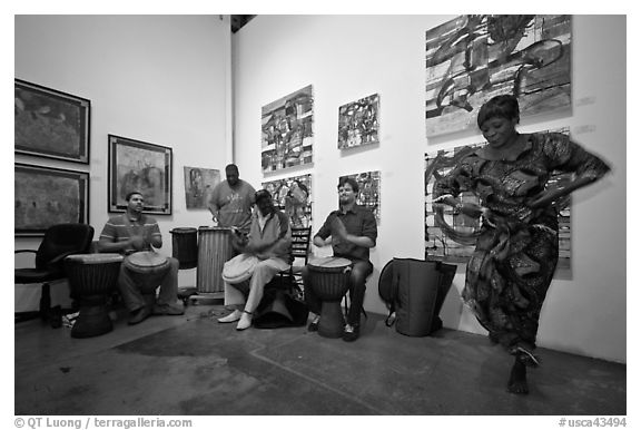 African drums and dance inside art gallery, Bergamot Station. Santa Monica, Los Angeles, California, USA (black and white)