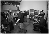 Guest dance to drums on art gallery opening night, Bergamot Station. Santa Monica, Los Angeles, California, USA (black and white)