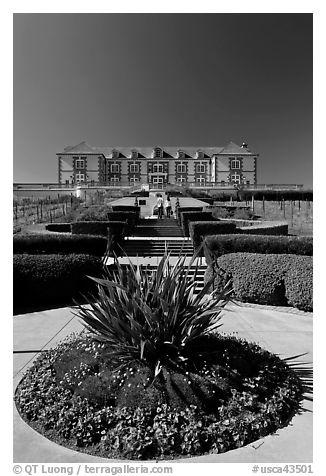 Domain Carneros winery with couple walking upstairs. Napa Valley, California, USA (black and white)