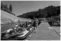 Deck with family preparing a boat, Shasta Lake. California, USA (black and white)