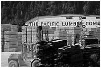 Lumber and forklift, Pacific Lumber Company, Scotia. California, USA (black and white)