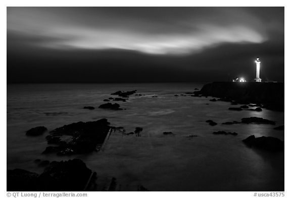 Night coastal scene with ocean and Lighthouse, Point Arena. California, USA (black and white)