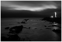 Night coastal scene with ocean and Lighthouse, Point Arena. California, USA (black and white)