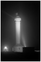 Point Arena Lighthouse on foggy night. California, USA ( black and white)
