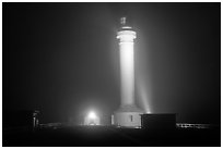 Fog and Point Arena Lighthouse by night. California, USA ( black and white)