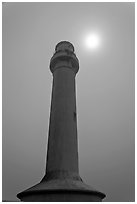 Point Arena Lighthouse and sun through fog. California, USA ( black and white)
