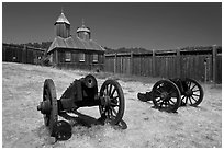 Cannons and chapel, Fort Ross Historical State Park. Sonoma Coast, California, USA ( black and white)
